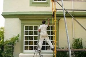 professional house painters working on a charlestown home in august